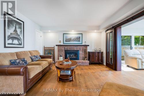 38 Willow Drive, Tiny, ON - Indoor Photo Showing Living Room With Fireplace