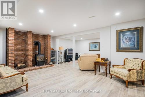 38 Willow Drive, Tiny, ON - Indoor With Fireplace