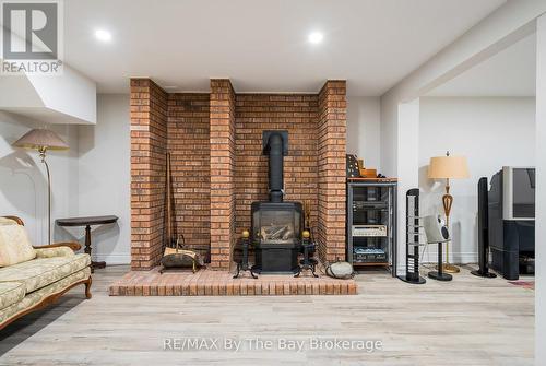 38 Willow Drive, Tiny, ON - Indoor With Fireplace