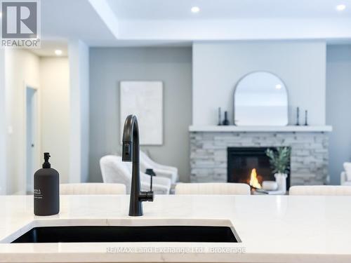 920 Bogdanovic Way, Huron-Kinloss, ON - Indoor Photo Showing Kitchen With Fireplace