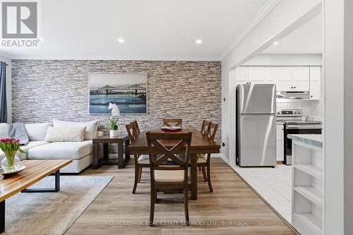 New Laminate Flooring T/O Living and Dining Areas - 51 - 26 Moss Boulevard, Hamilton, ON - Indoor Photo Showing Other Room With Fireplace