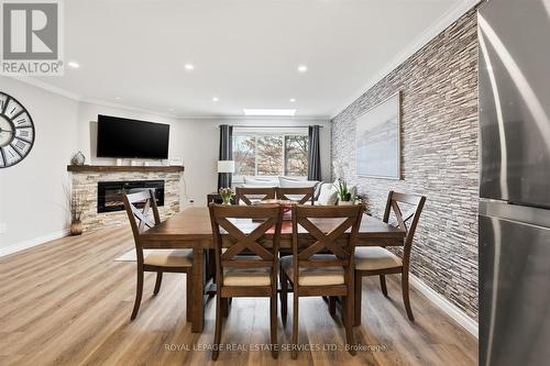 The Open Concept Design is Ideal for Entertaining - 51 - 26 Moss Boulevard, Hamilton, ON - Indoor Photo Showing Dining Room With Fireplace