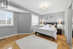 Generous Primary Bedroom Boasts Parquet Flooring - 