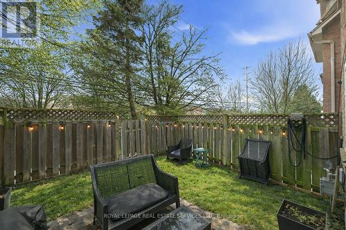 Image Digitally Altered to Depict Summer Condition - 51 - 26 Moss Boulevard, Hamilton, ON - Outdoor With Backyard