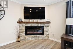 Living Room Features a Corner Electric Fireplace - 