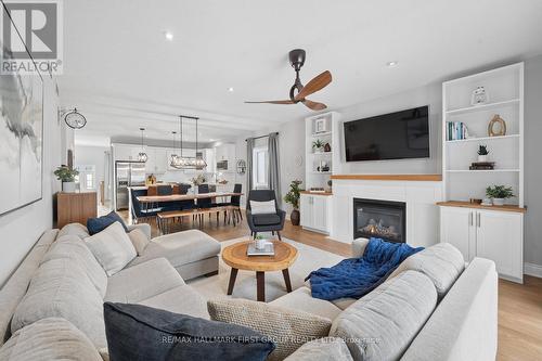 11 Lonetto Street, Whitby, ON - Indoor Photo Showing Living Room With Fireplace