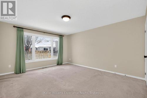 Primary Suite with Double Closets and Ensuite Bath - 943 Playfair Road, Midland, ON - Indoor Photo Showing Other Room