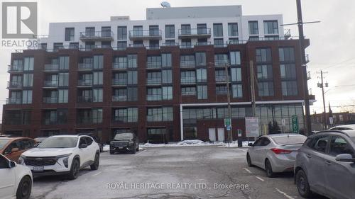 602 - 201 Brock Street S, Whitby, ON - Outdoor With Facade