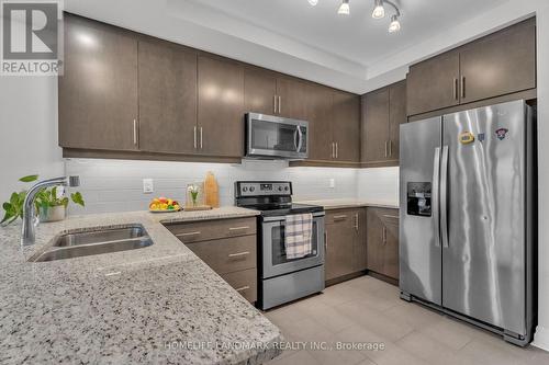 313 - 260 Villagewalk Boulevard, London North, ON - Indoor Photo Showing Kitchen With Stainless Steel Kitchen With Double Sink
