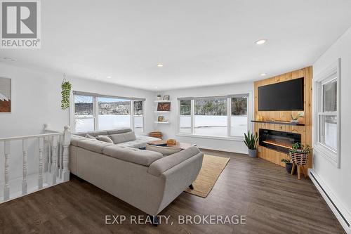 38 Rebecca Lane, Westport, ON - Indoor Photo Showing Living Room With Fireplace