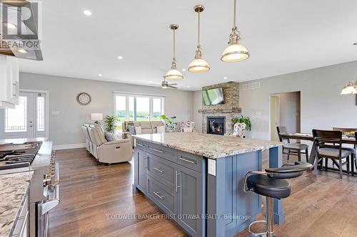 High 9' ceilings and clear sightlines - 800 Waba Road, Mississippi Mills, ON - Indoor Photo Showing Kitchen With Fireplace With Upgraded Kitchen