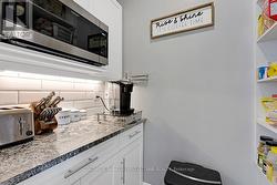 Butler's pantry granite counter & coffee station - 