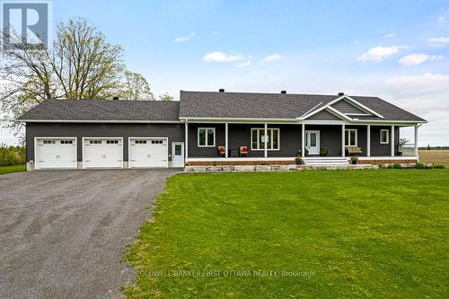 Summer view of this executive-style home - 800 Waba Road, Mississippi Mills, ON - Outdoor With Deck Patio Veranda With Facade