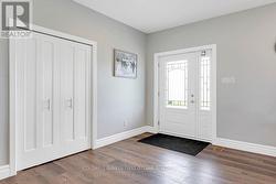 Bright white foyer with double closet - 