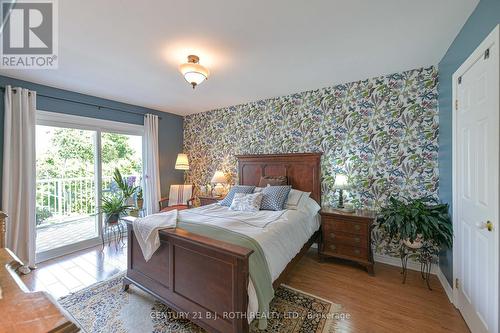 King size primary bedroom, wake up to a lake view! - 204 - 43 Creighton Street, Ramara, ON - Indoor Photo Showing Bedroom