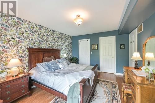 Primary bedroom with walk in closet and ensuite - 204 - 43 Creighton Street, Ramara, ON - Indoor Photo Showing Bedroom