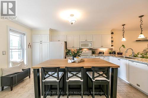 Butcher block island with additional storage - 204 - 43 Creighton Street, Ramara, ON - Indoor Photo Showing Kitchen