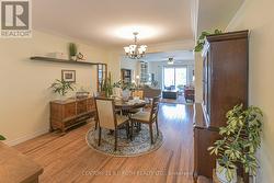 Dining room open to living area, laminate flooring - 
