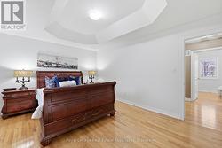 Master bedroom with coffered ceilings & w/i closet - 