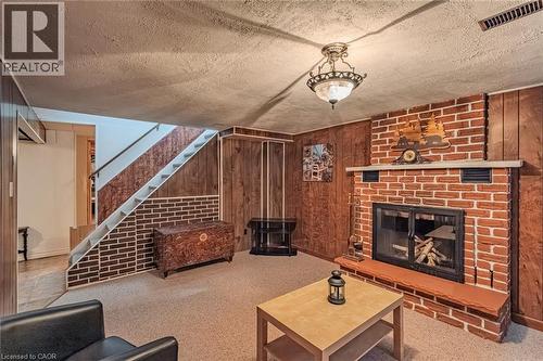 26 Douglas Avenue, Simcoe, ON - Indoor Photo Showing Living Room With Fireplace