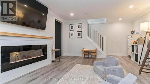 295 Admiral Drive, London East (East I), ON - Indoor Photo Showing Living Room With Fireplace