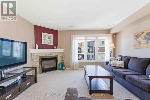 21 - 1660 Locksley Lane, Ottawa, ON - Indoor Photo Showing Living Room With Fireplace