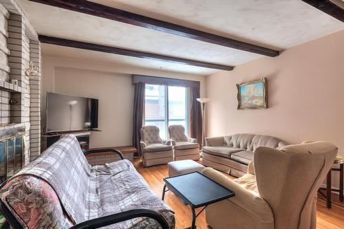 Salle familiale - 50 Rue Westpark, Dollard-Des-Ormeaux, QC - Indoor Photo Showing Living Room With Fireplace