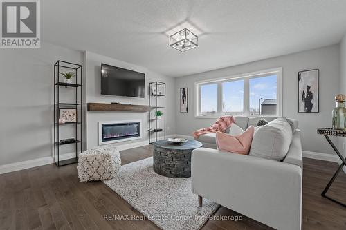 Photo is representation of Builders work - 190 Bridge Crescent, Minto, ON - Indoor Photo Showing Living Room With Fireplace