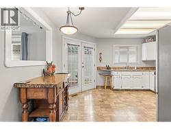 French doors & peek-a-boo to the living room/dining room - 