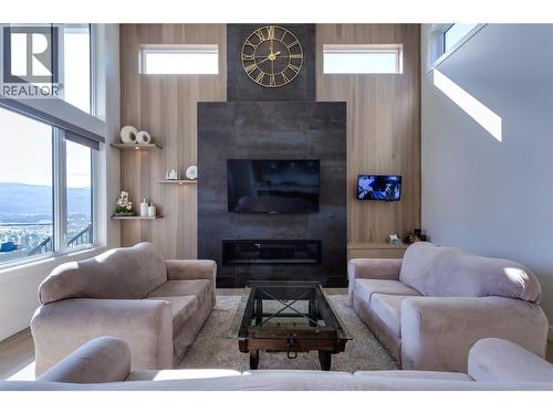 703 Carnoustie Drive, Kelowna, BC - Indoor Photo Showing Living Room With Fireplace