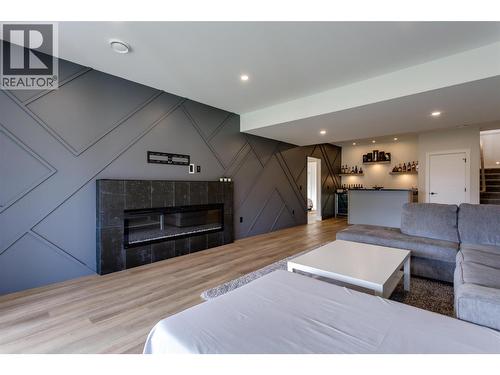 703 Carnoustie Drive, Kelowna, BC - Indoor Photo Showing Living Room With Fireplace