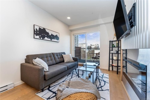 405-1033 Cook St, Victoria, BC - Indoor Photo Showing Living Room With Fireplace