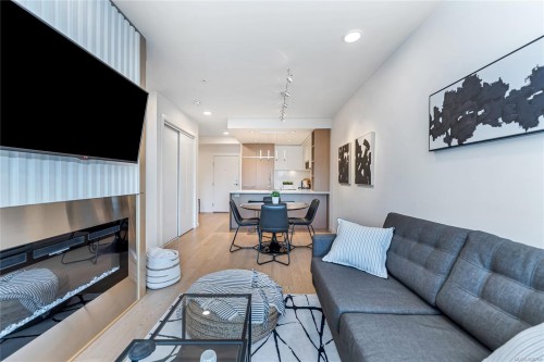 405-1033 Cook St, Victoria, BC - Indoor Photo Showing Living Room With Fireplace