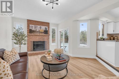 1 Balfour Court, Guelph (Kortright East), ON - Indoor Photo Showing Living Room With Fireplace