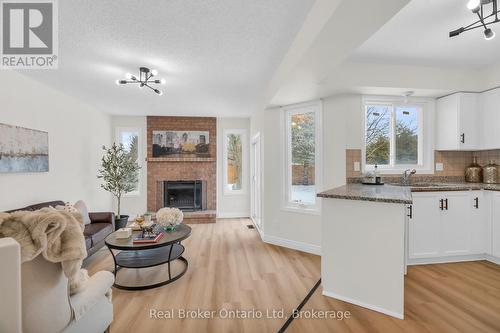 1 Balfour Court, Guelph (Kortright East), ON - Indoor With Fireplace
