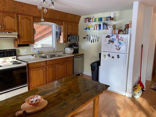 Plenty of cabinets - 111 2Nd Avenue S, Swan River, MB - Indoor Photo Showing Kitchen With Double Sink