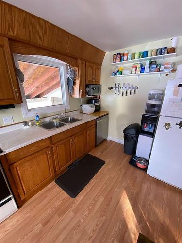 111 2Nd Avenue S, Swan River, MB - Indoor Photo Showing Kitchen With Double Sink