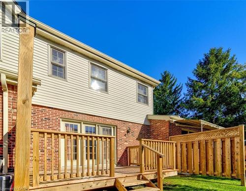 Spend sunny afternoons on your deck, with plenty of room for a BBQ and patio set to host family and friends. - 42 Donly Drive S Unit# 2, Simcoe, ON - Outdoor With Deck Patio Veranda