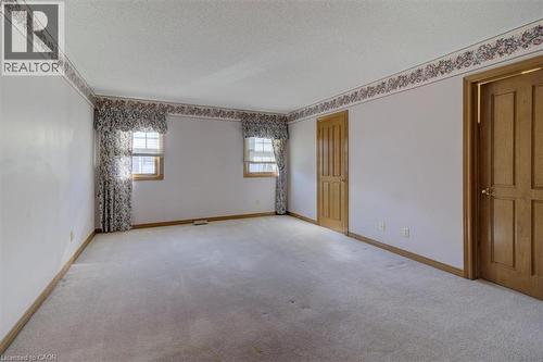 Wake up to sunlight in this south-facing primary bedroom, offering warmth and tranquility throughout the day. - 42 Donly Drive S Unit# 2, Simcoe, ON - Indoor Photo Showing Other Room