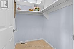 Primary Walk-In Closet - 