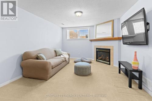 Lower Level Recreational Room with Fireplace - 437 Claridge Drive, Ottawa, ON - Indoor Photo Showing Living Room With Fireplace