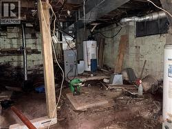Unfinished below grade area with water heater and heating unit - 