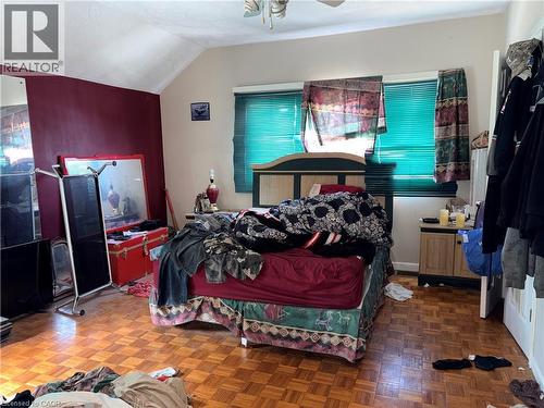 Bedroom with parquet floors, lofted ceiling, and ceiling fan - 14 Carlisle Street, Hamilton, ON - Indoor Photo Showing Bedroom