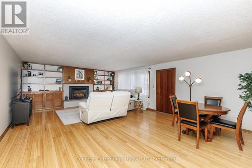 Living room with gleaming hardwood - 467 Gorham Rd Road, Fort Erie (Point Abino), ON - Indoor With Fireplace