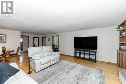 Living room with gleaming hardwood - 