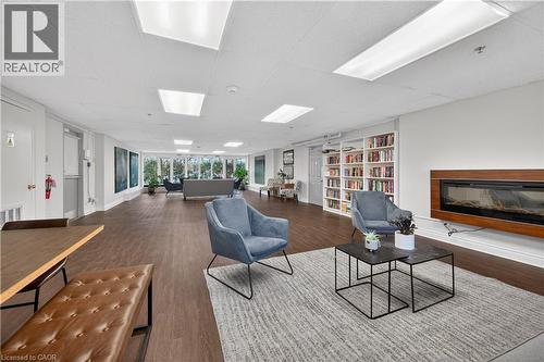 212 Kerr Street Unit# 702, Oakville, ON - Indoor Photo Showing Living Room With Fireplace