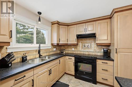 3837 Holmes Road, Frontenac (Frontenac South), ON - Indoor Photo Showing Kitchen With Double Sink