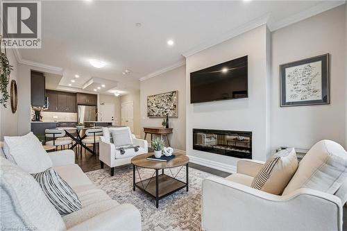 1880 Gordon Street Unit# 809, Guelph, ON - Indoor Photo Showing Living Room With Fireplace