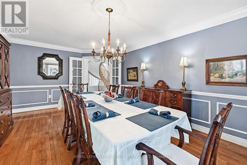 Elegant Dining Room with Hardwood Flooring - 2017 Peak Place, Oakville, ON - Indoor Photo Showing Dining Room