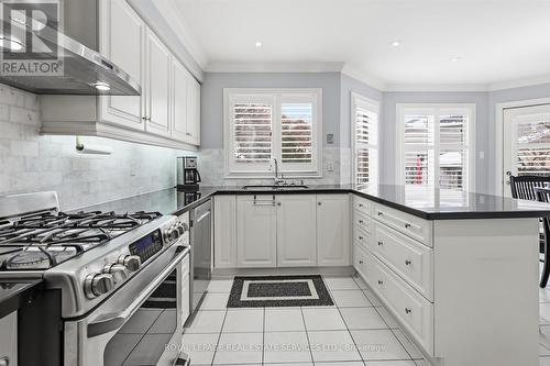 Gourmet Kitchen Features Granite Countertops - 2017 Peak Place, Oakville, ON - Indoor Photo Showing Kitchen With Upgraded Kitchen